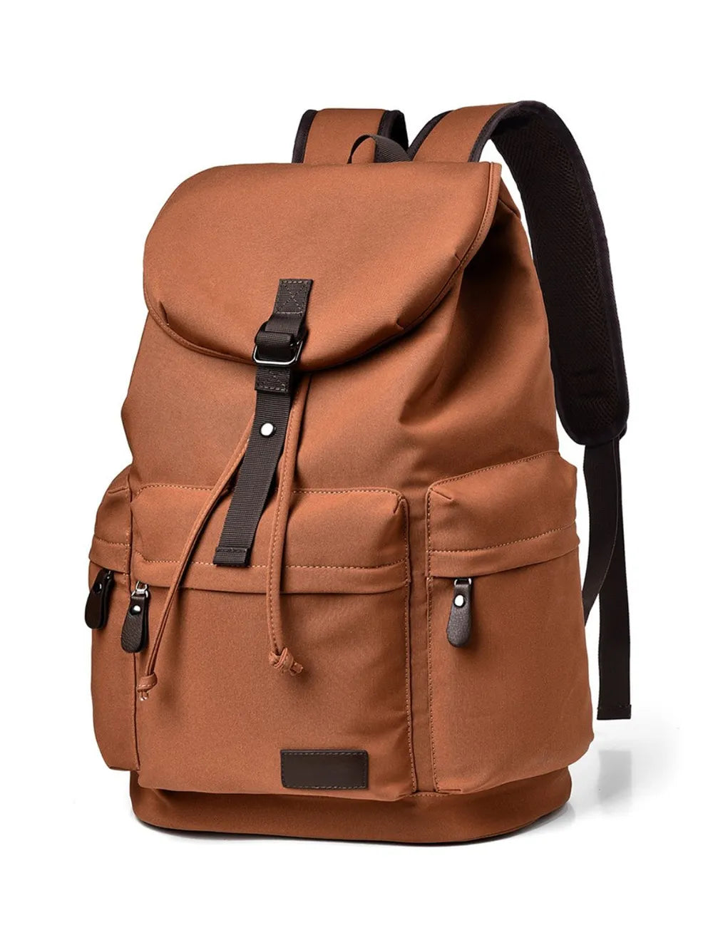Front view of a brown backpack made with canvas material. There are two lower side pockets, one on either side, and another pocket on the front. There is a large flap on the top and front, covering the main compartment of the bag. Zip tags and trimmings are coffee brown.