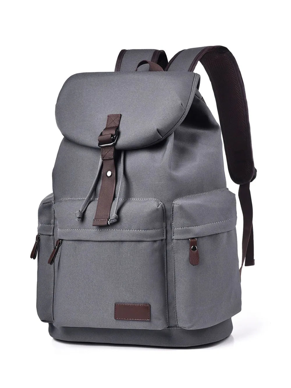 Front view of a grey backpack made with canvas material. There are two lower side pockets, one on either side, and another pocket on the front. There is a large flap on the top and front, covering the main compartment of the bag. Zip tags and trimmings are coffee brown.